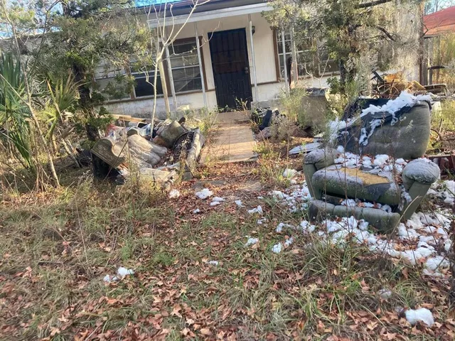 a view of open kitchen with two chair and a fire pit