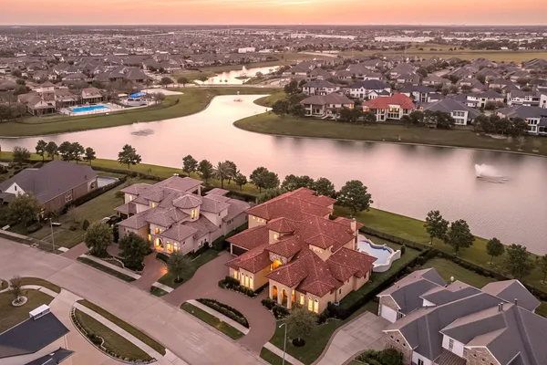 an aerial view of residential houses with outdoor space