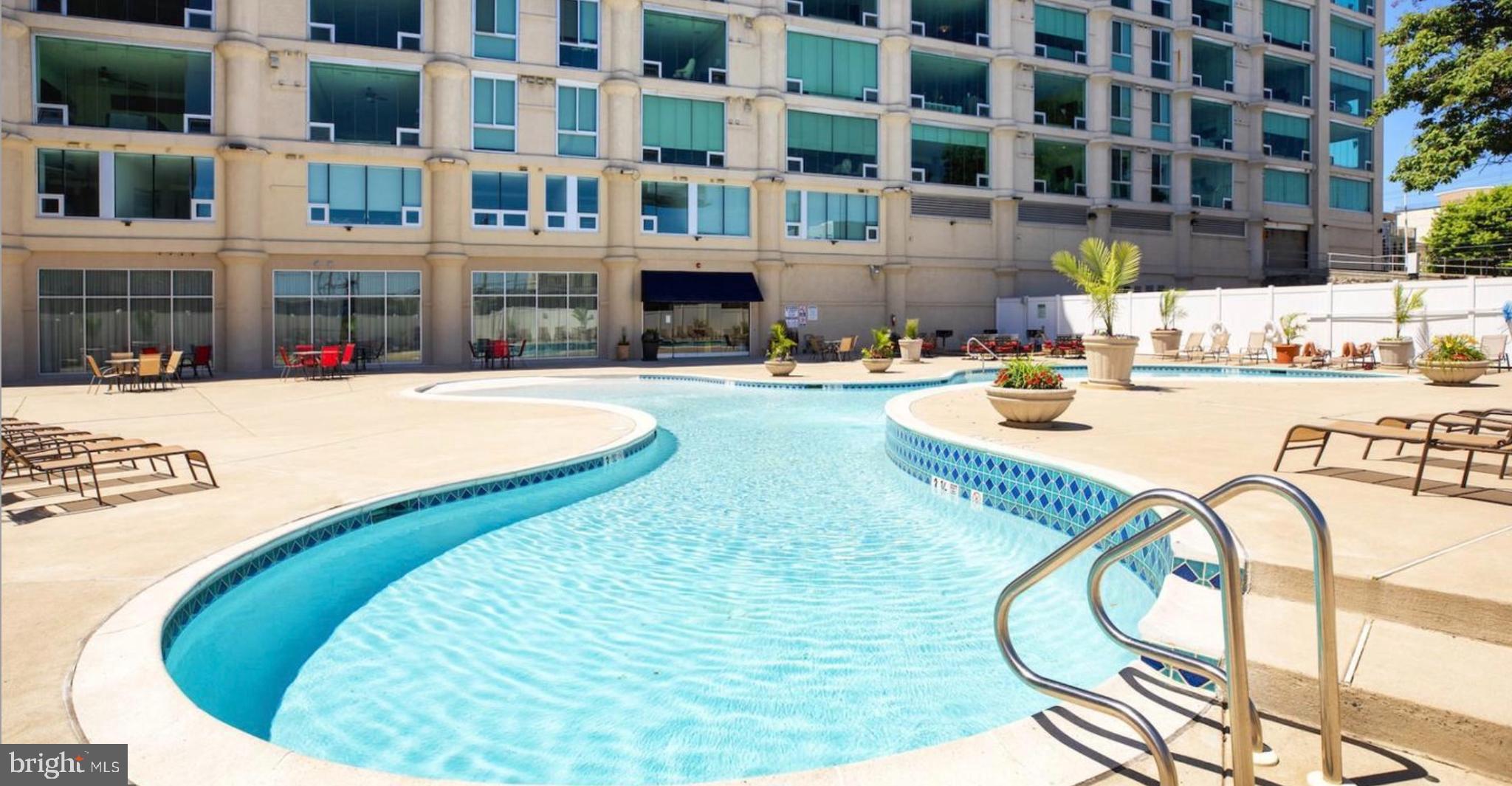 1 Brown Street, Unit STUDIO Philadelphia, PA 19123 - Photo 2 of 14 a swimming pool with outdoor seating and yard