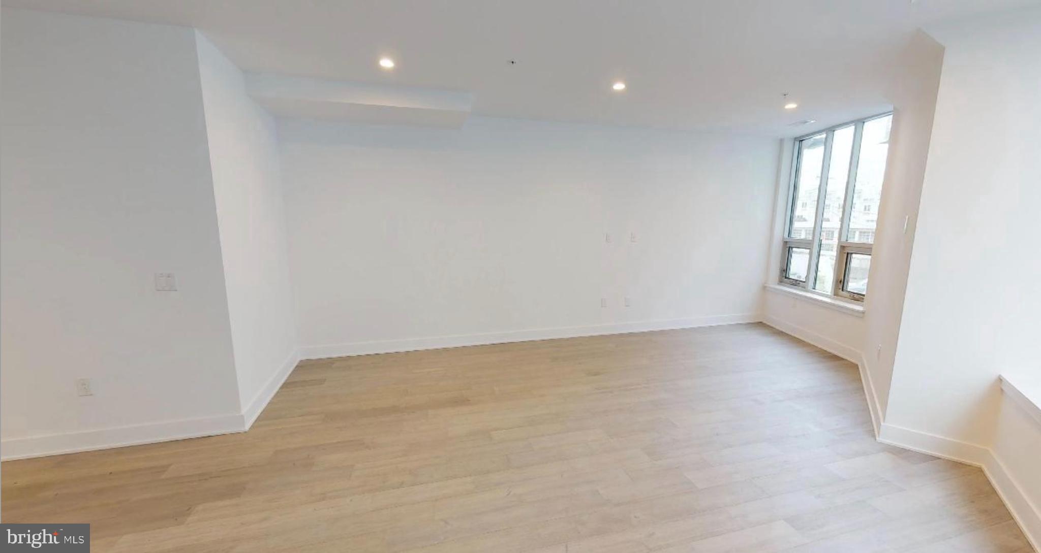 1 Brown Street, Unit STUDIO Philadelphia, PA 19123 - Photo 5 of 14 an empty room with windows