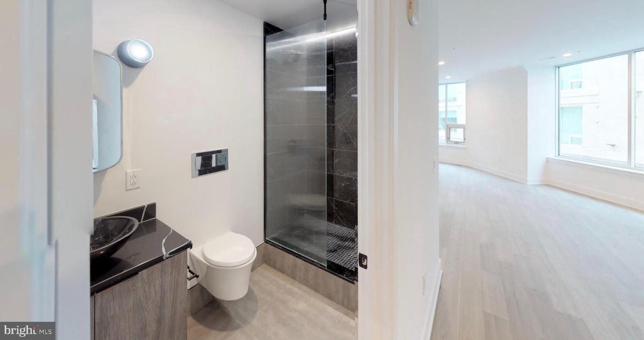 1 Brown Street, Unit STUDIO Philadelphia, PA 19123 - Photo 6 of 14 a bathroom with a toilet and a shower