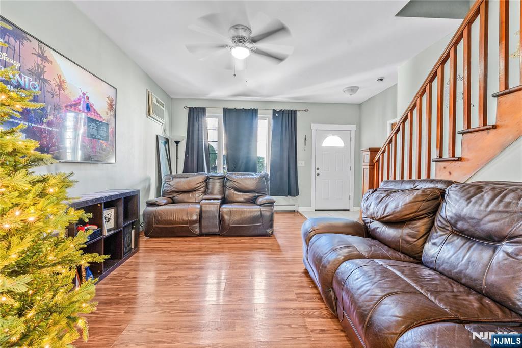 78 Columbia Street Wood-Ridge, NJ 07075 - Photo 6 of 25 a living room with furniture and a potted plant
