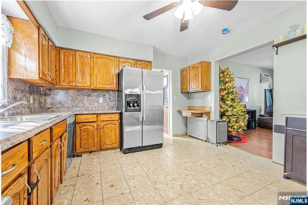 78 Columbia Street Wood-Ridge, NJ 07075 - Photo 9 of 25 a kitchen with granite countertop a refrigerator and a sink