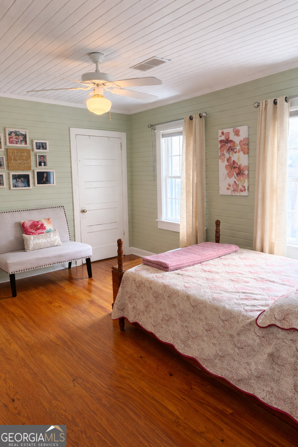 223 Holt Street Thomson, GA 30824 - Photo 18 of 24 a bedroom with a bed and a window