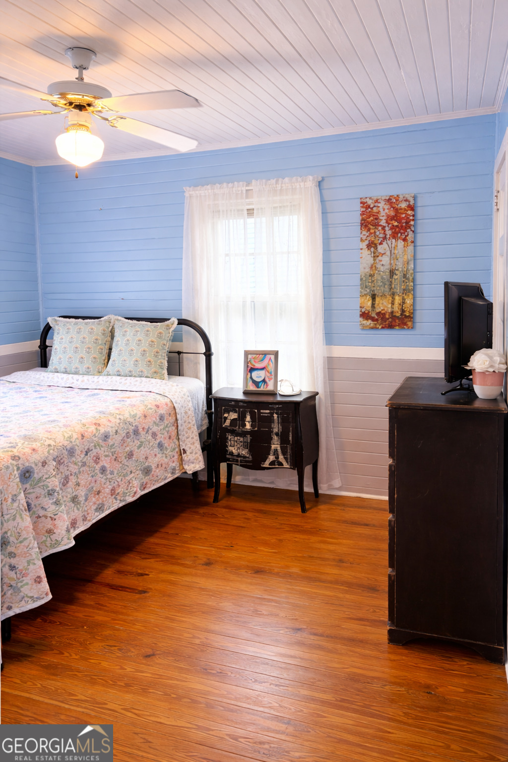 223 Holt Street Thomson, GA 30824 - Photo 20 of 24 a bedroom with a bed and a desk