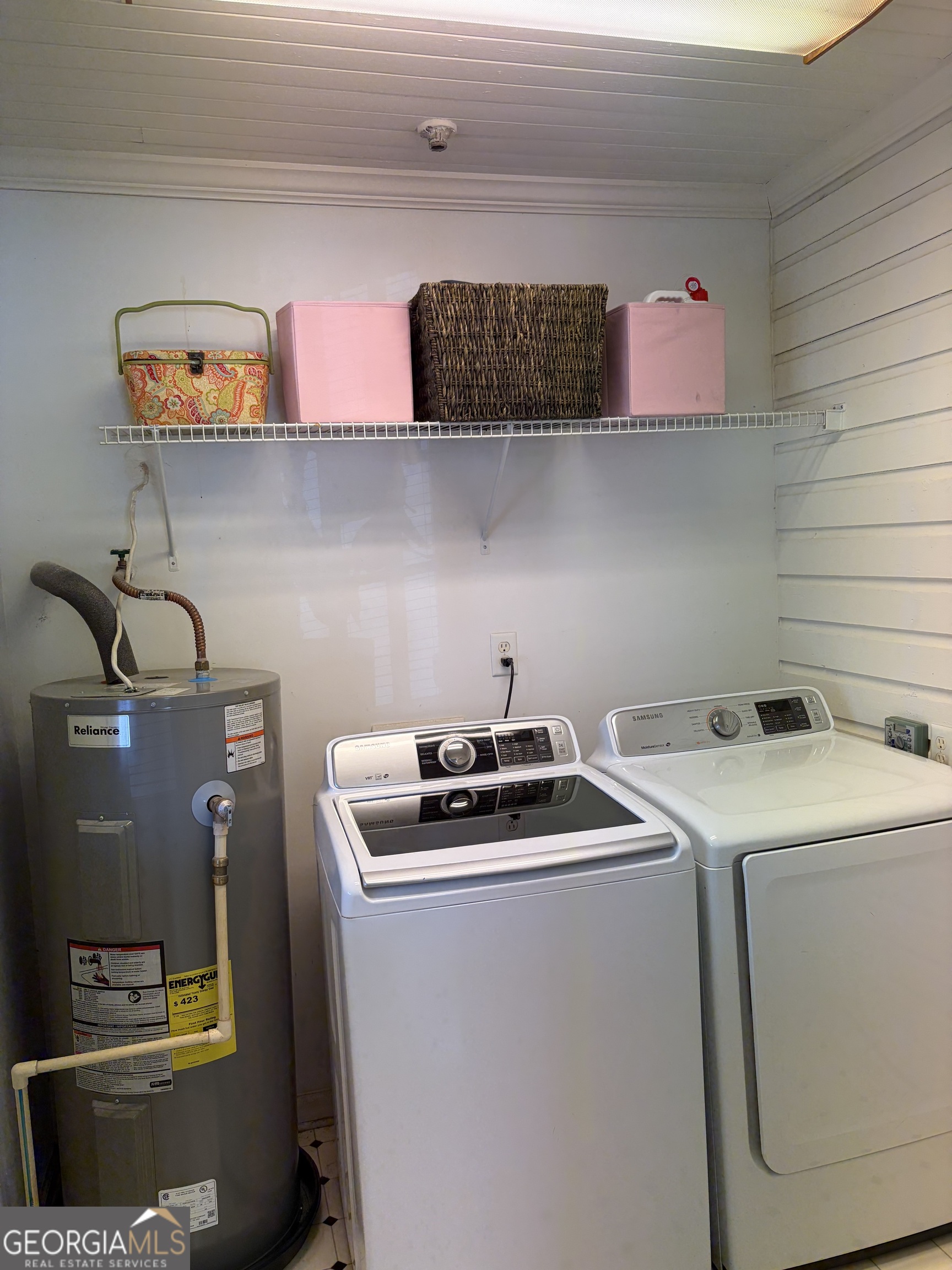 223 Holt Street Thomson, GA 30824 - Photo 22 of 24 a utility room with dryer and washer