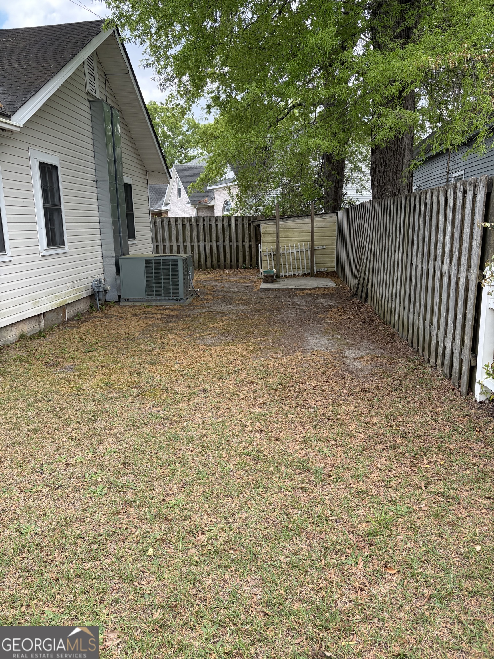 223 Holt Street Thomson, GA 30824 - Photo 23 of 24 a view of house with backyard and deck