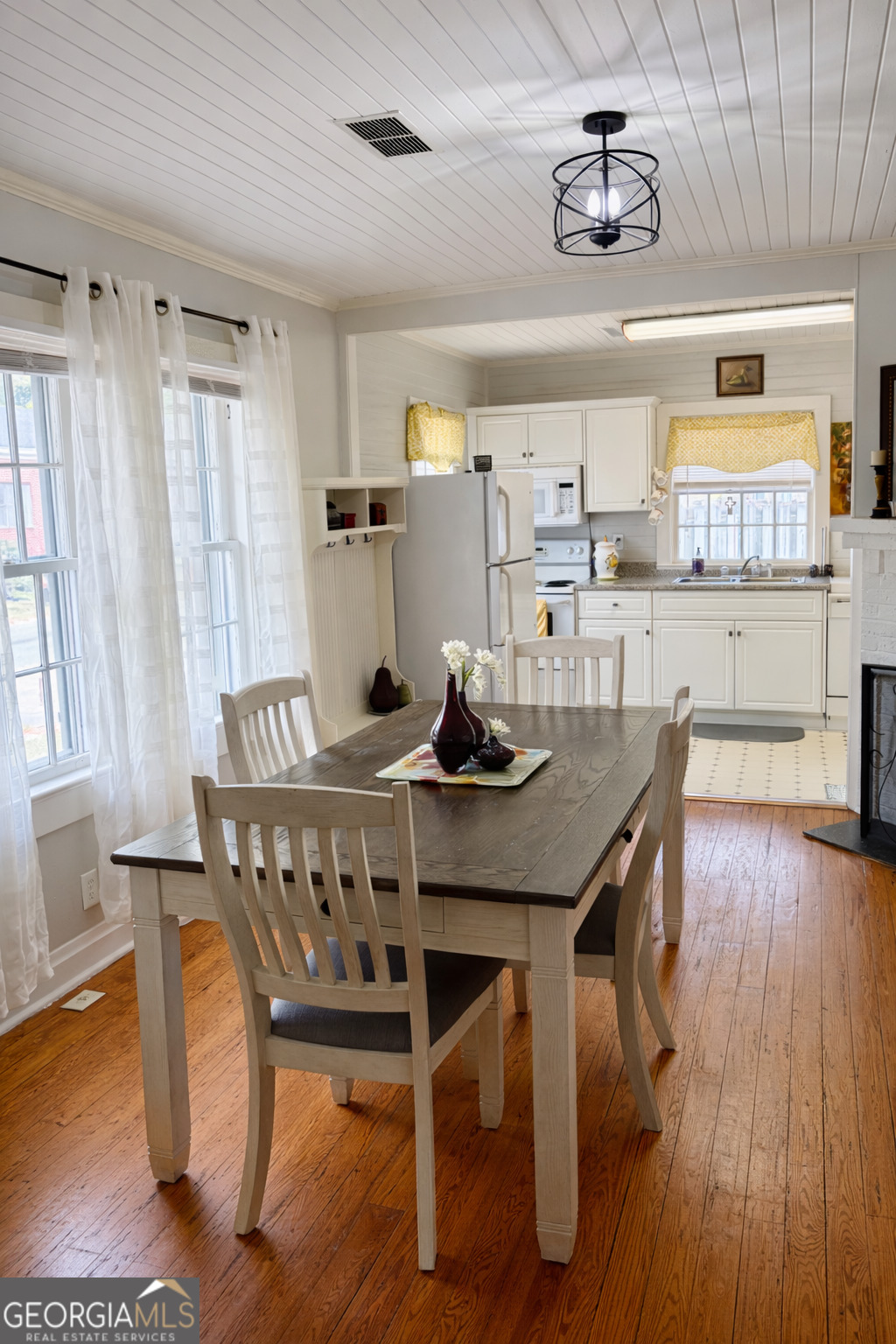 223 Holt Street Thomson, GA 30824 - Photo 8 of 24 a view of a dining room with furniture window and wooden floor