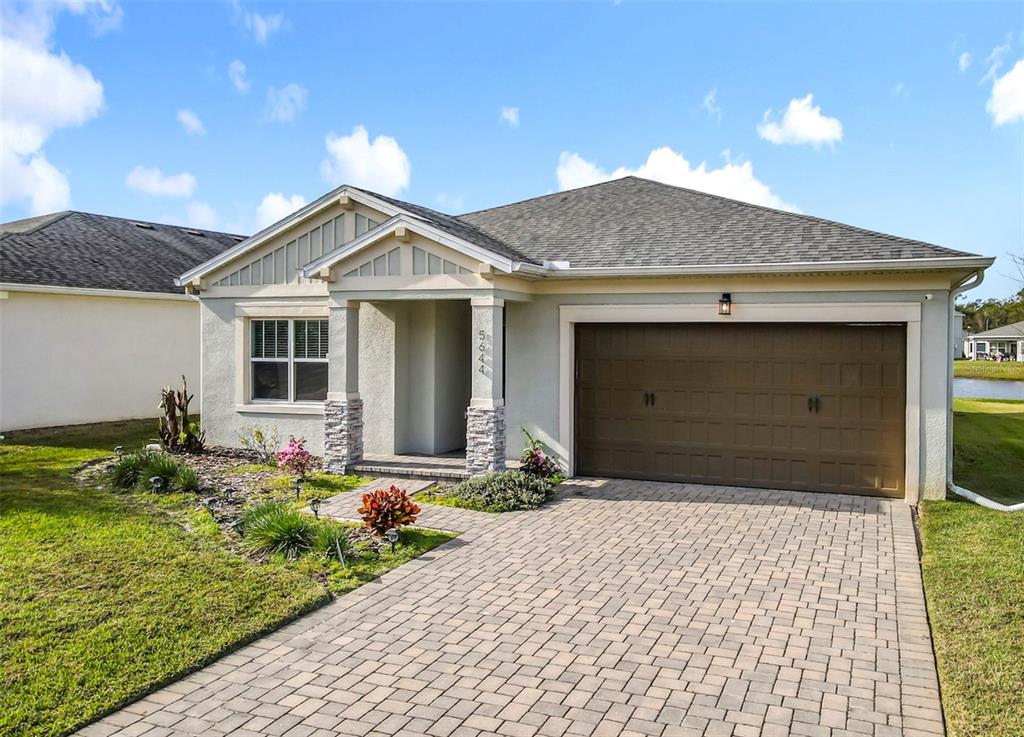 5644 Estero Loop Port Orange, FL 32128 - Photo 1 of 50 a front view of a house with a yard