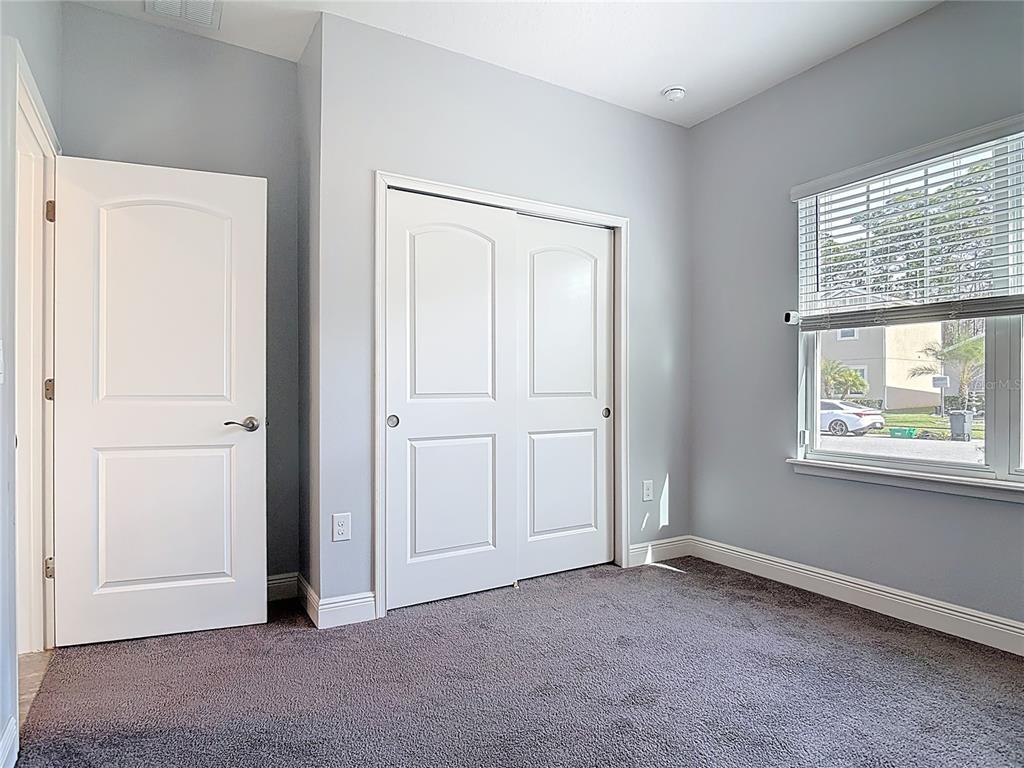 5644 Estero Loop Port Orange, FL 32128 - Photo 22 of 50 an empty room with windows and closet