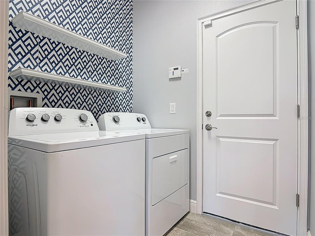 5644 Estero Loop Port Orange, FL 32128 - Photo 28 of 50 a utility room with dryer and washer