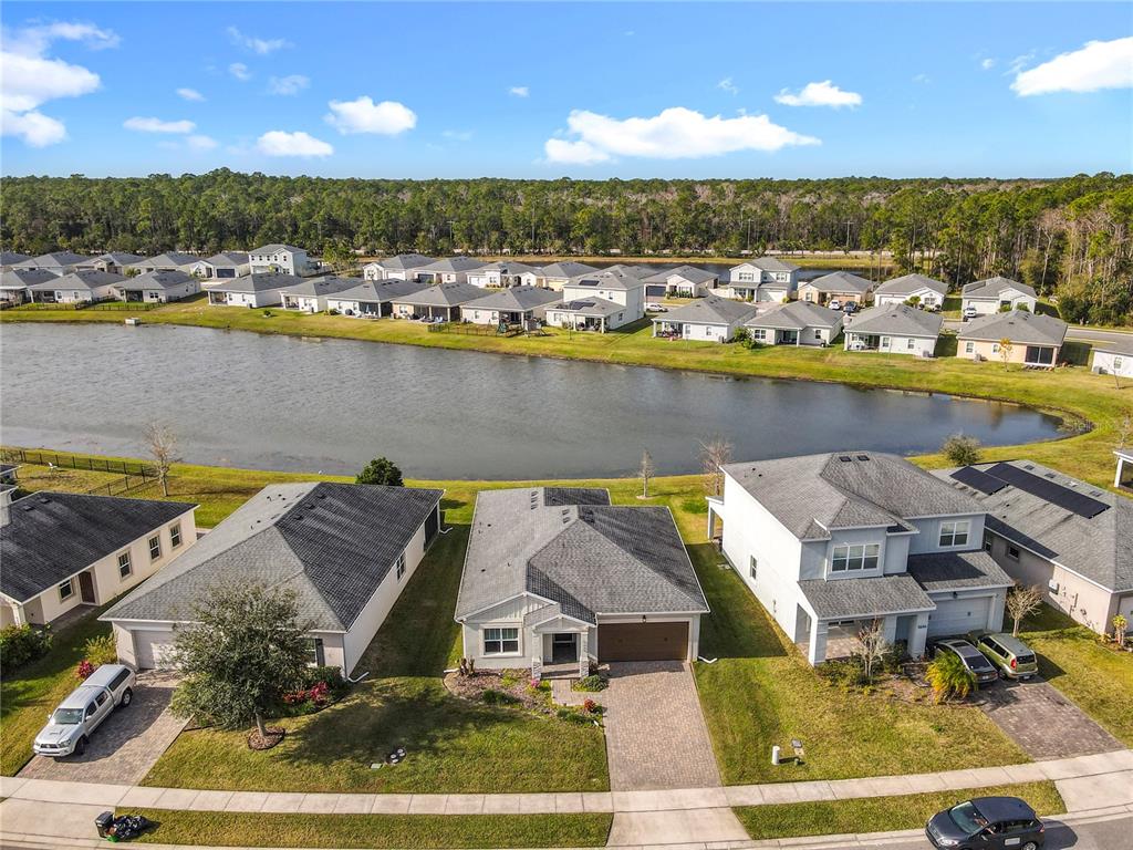 5644 Estero Loop Port Orange, FL 32128 - Photo 39 of 50 an aerial view of a house with a lake view