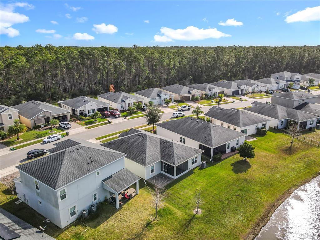 5644 Estero Loop Port Orange, FL 32128 - Photo 42 of 50 a aerial view of a house with swimming pool and ocean view