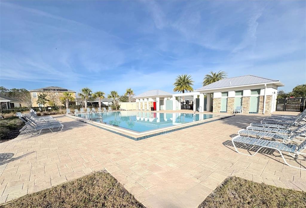5644 Estero Loop Port Orange, FL 32128 - Photo 48 of 50 a view of a house with swimming pool and sitting area