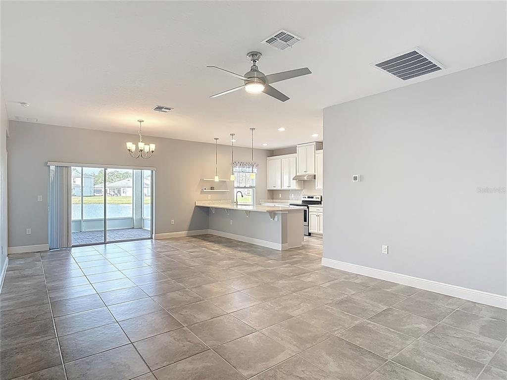5644 Estero Loop Port Orange, FL 32128 - Photo 10 of 50 a view of kitchen with a sink appliances and cabinets