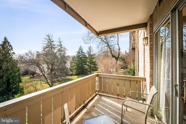 a view of a balcony with wooden floor and outdoor space