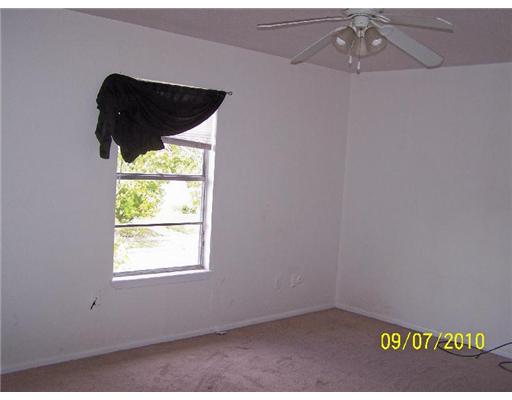 5011 Meandering Lane, Unit A Corpus Christi, TX 78413 - Photo 6 of 10 an empty room with a window