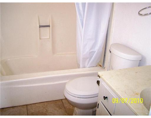 5011 Meandering Lane, Unit A Corpus Christi, TX 78413 - Photo 7 of 10 a bathroom with a sink a toilet and a bathtub