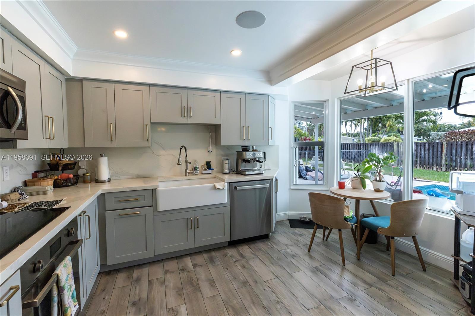 12415 Southwest 93rd Court Miami, FL 33176 - Photo 13 of 30 a kitchen with a sink cabinets and window