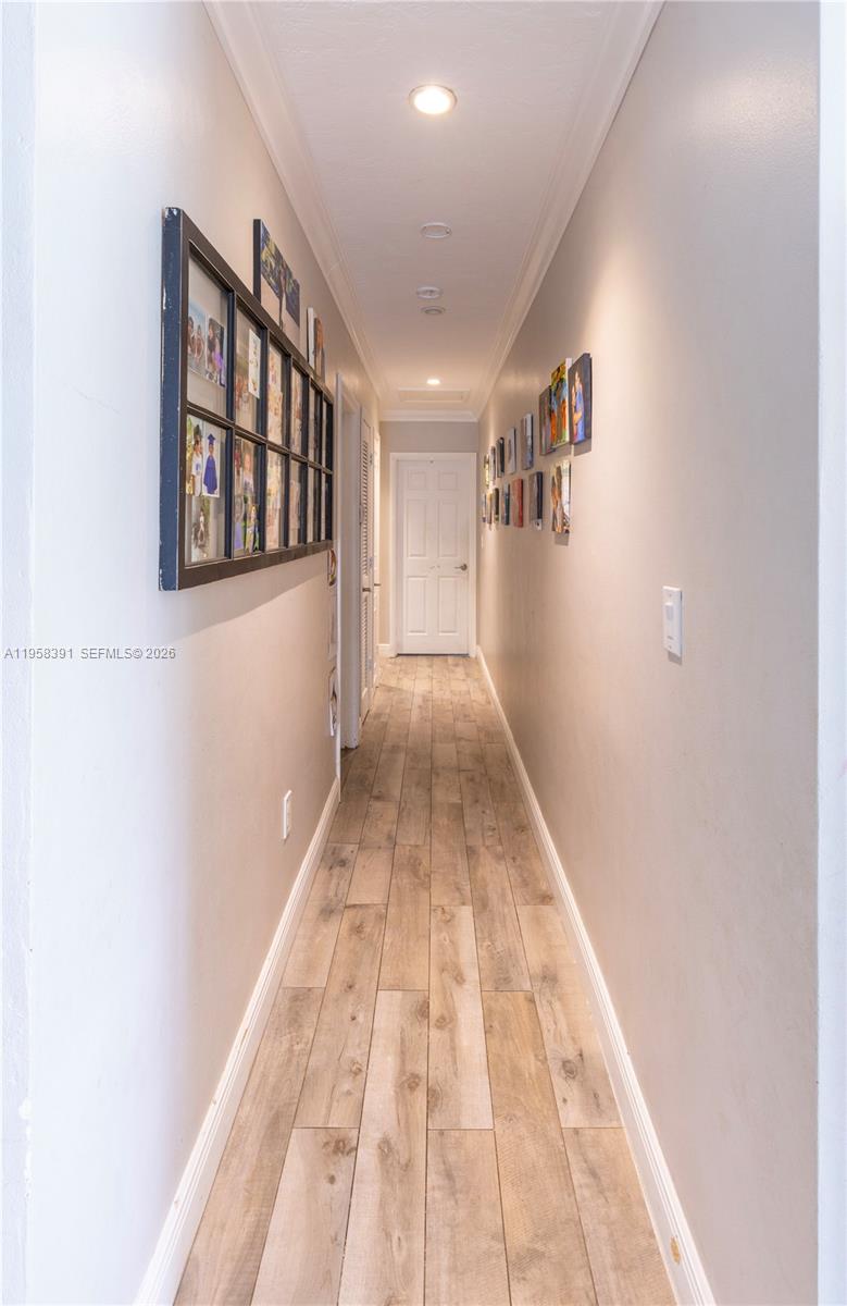 12415 Southwest 93rd Court Miami, FL 33176 - Photo 15 of 30 a view of a hallway with wooden floor