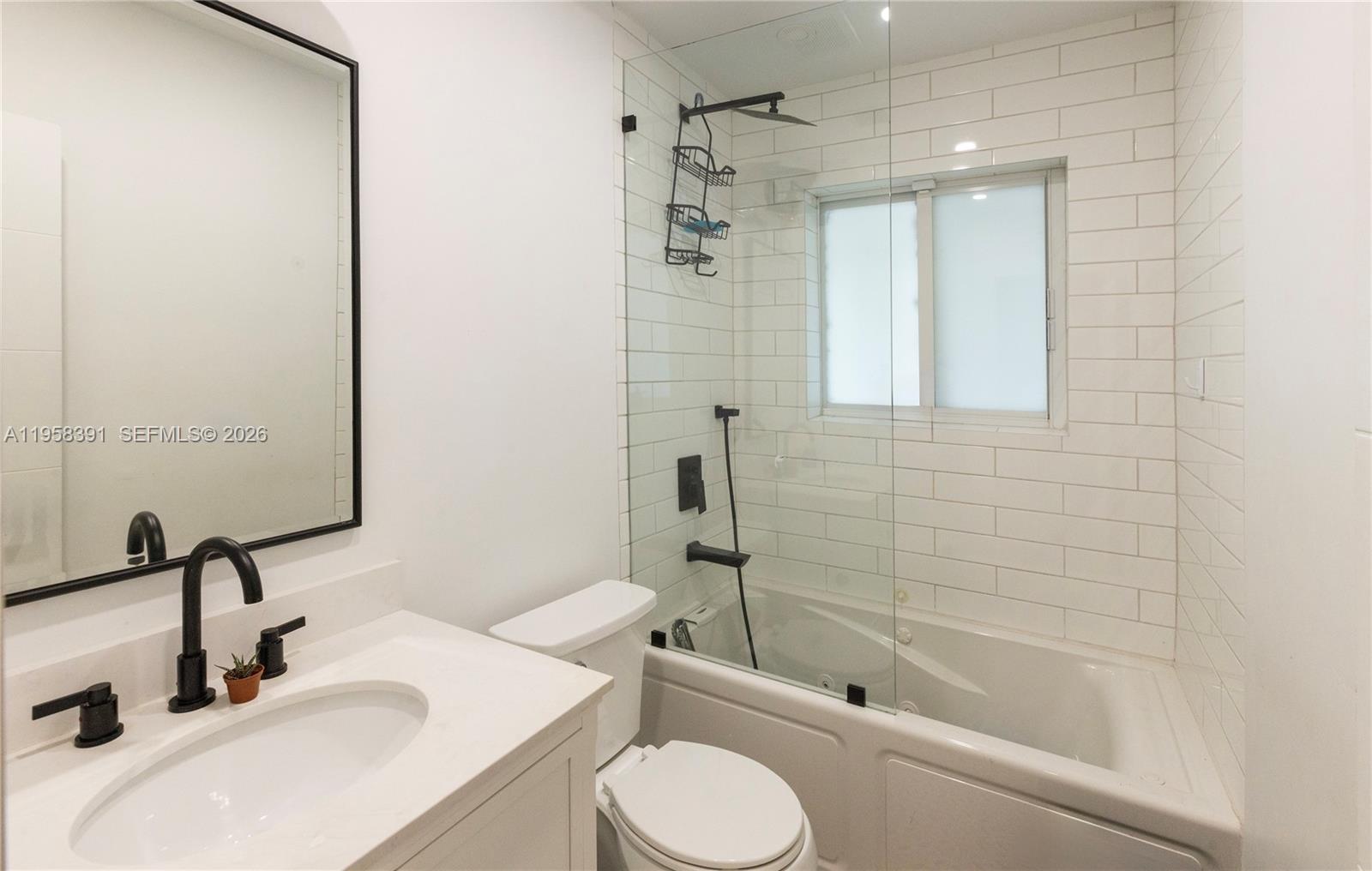12415 Southwest 93rd Court Miami, FL 33176 - Photo 19 of 30 a bathroom with a sink toilet and shower