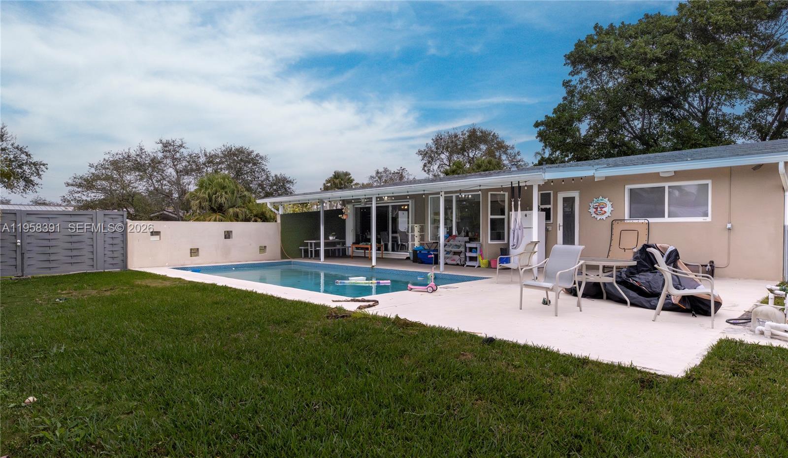12415 Southwest 93rd Court Miami, FL 33176 - Photo 23 of 30 a view of a house with backyard and sitting area