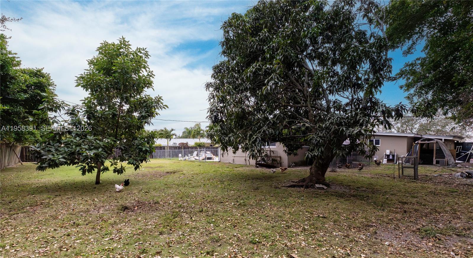 12415 Southwest 93rd Court Miami, FL 33176 - Photo 24 of 30 a view of a large tree in front of a house