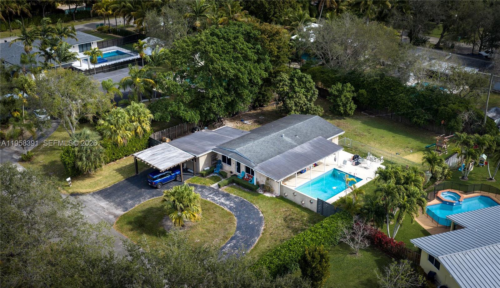 12415 Southwest 93rd Court Miami, FL 33176 - Photo 27 of 30 an aerial view of a house with swimming pool a yard and outdoor seating