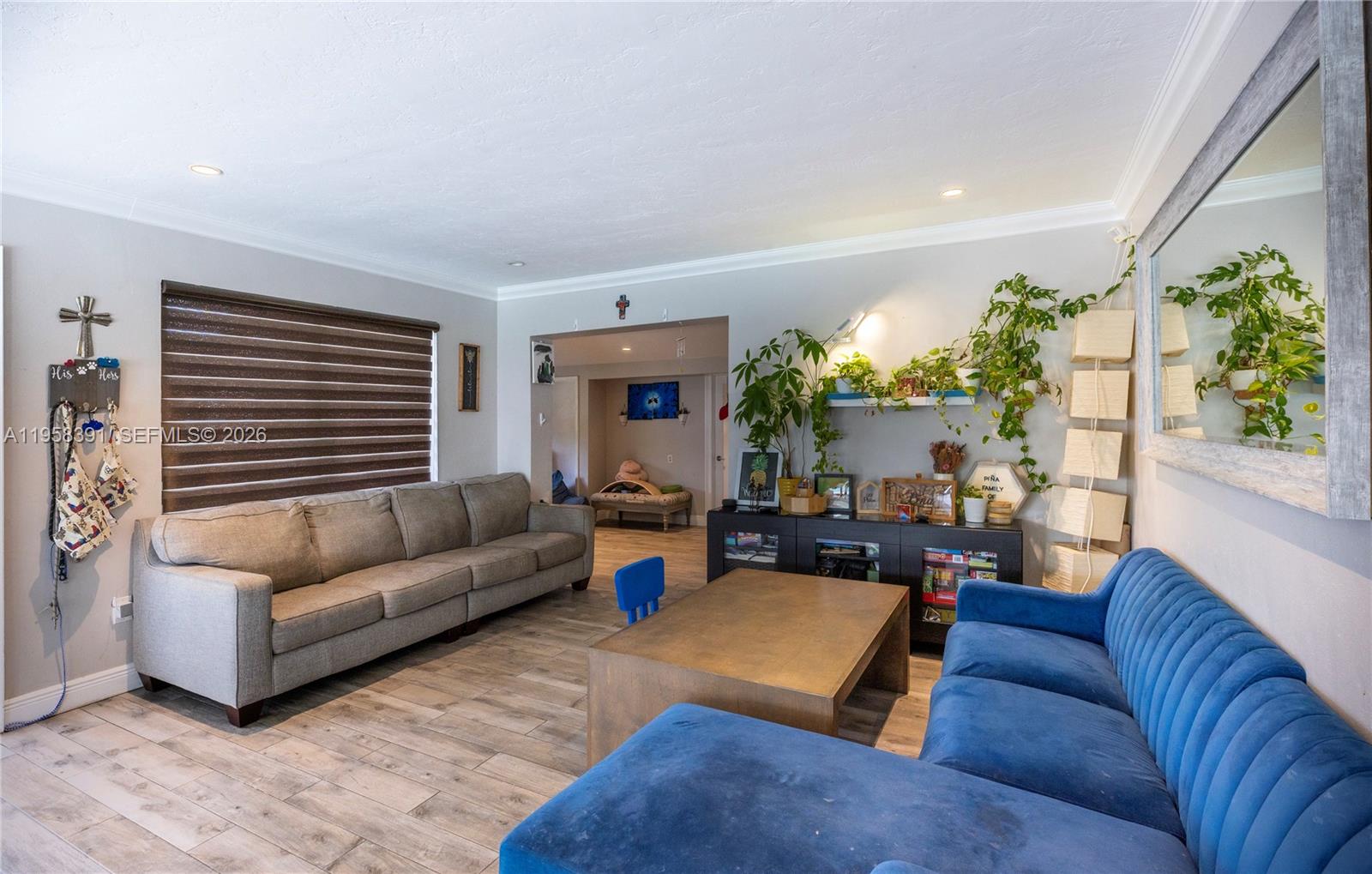 12415 Southwest 93rd Court Miami, FL 33176 - Photo 4 of 30 a living room with furniture and a large window