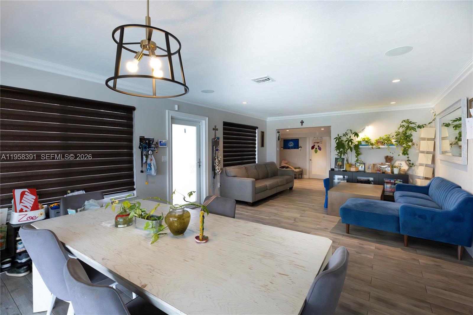 12415 Southwest 93rd Court Miami, FL 33176 - Photo 5 of 30 a living room with fireplace furniture and a flat screen tv