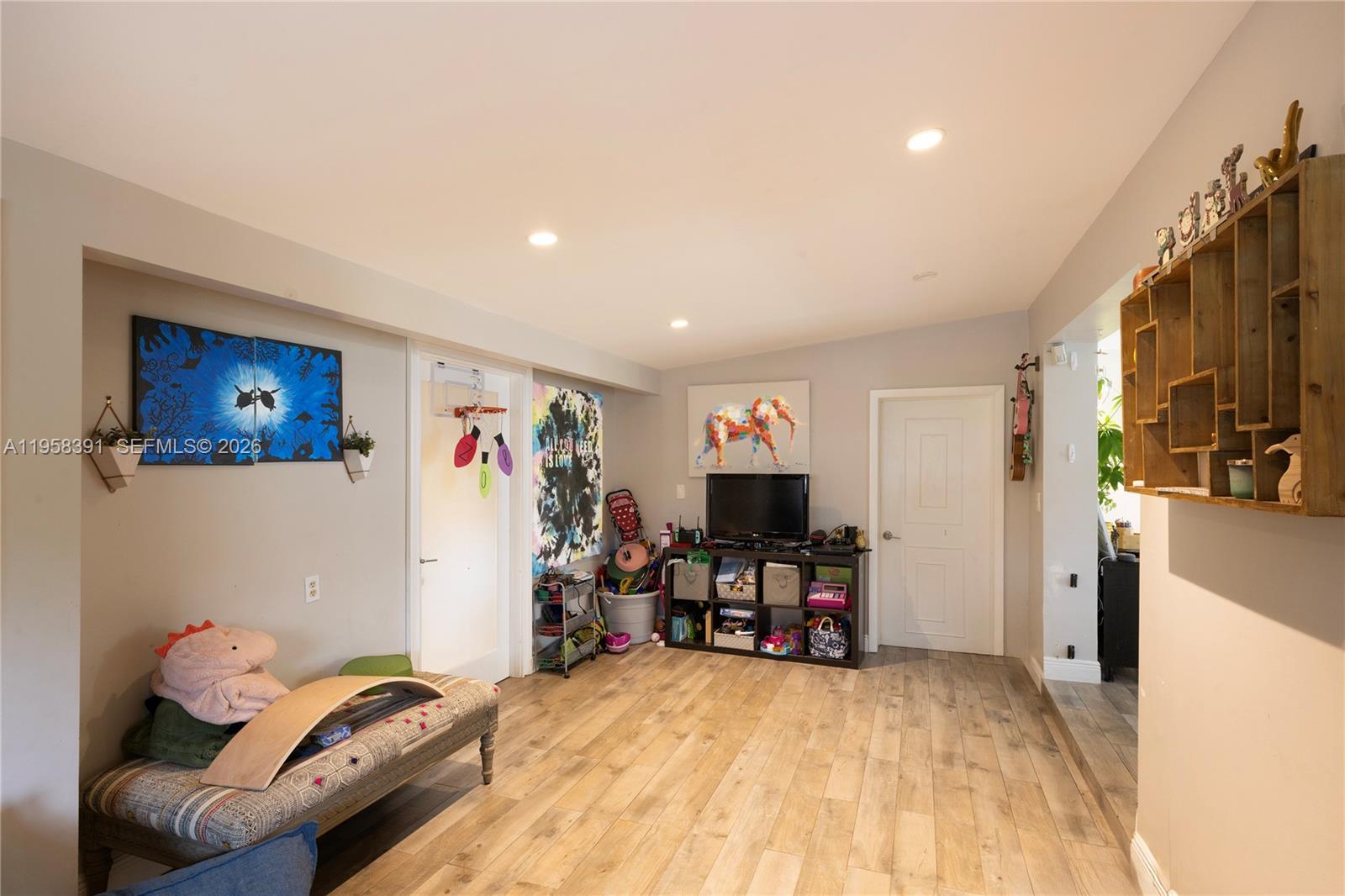 12415 Southwest 93rd Court Miami, FL 33176 - Photo 6 of 30 a view of a livingroom with workspace and a couch