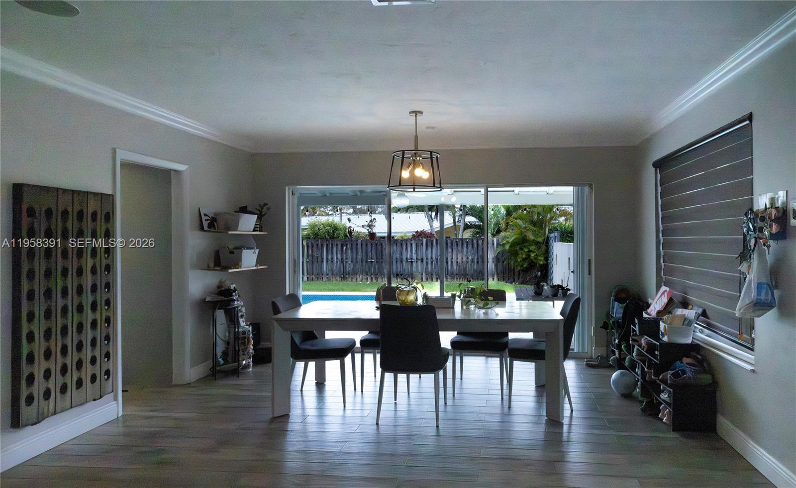 12415 Southwest 93rd Court Miami, FL 33176 - Photo 10 of 30 a dining room with furniture window and wooden floor