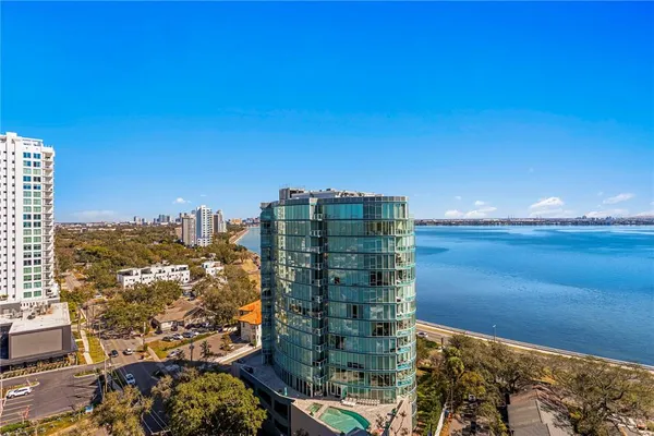 a kitchen with granite countertop a sink a stove and cabinets