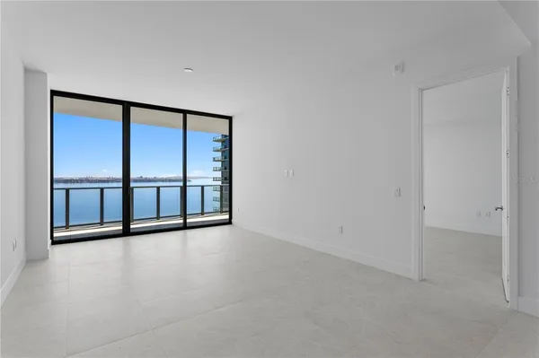 a view of a kitchen with a sink and cabinets