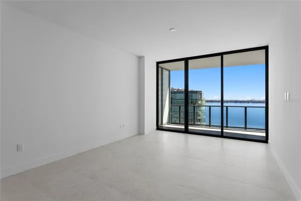 a bathroom with a granite countertop sink toilet and a mirror