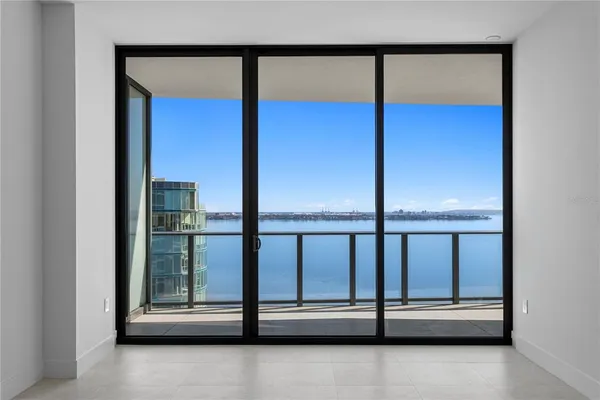 a bathroom with a shower and a sink