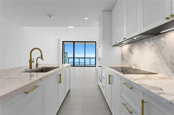 a room with lots of furniture and a large window