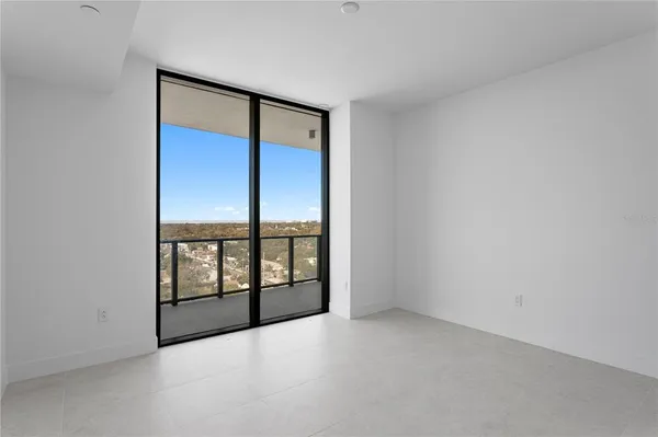 a bathroom with a glass door shower