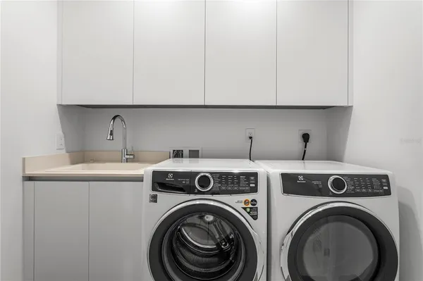 a bathroom with a shower and a sink