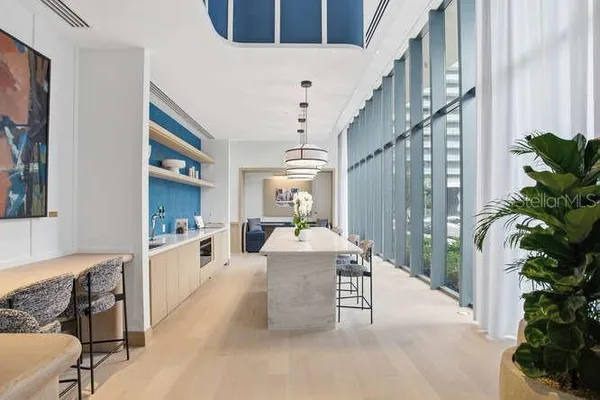 a view of a couches and lounge chairs in patio