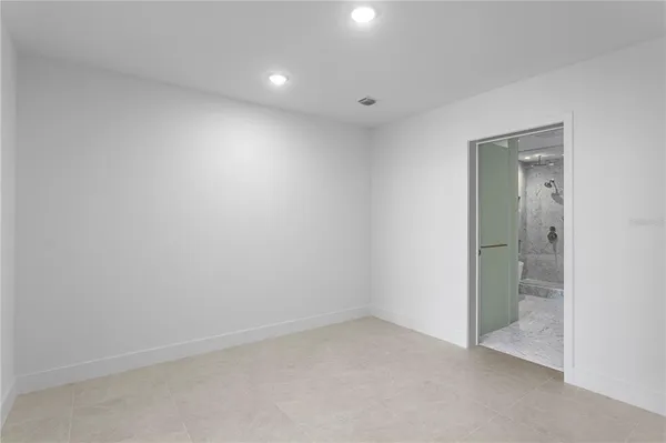 a bathroom with a double vanity sink and mirror