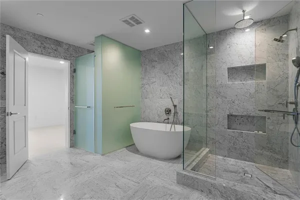 an empty room with sliding glass door and balcony