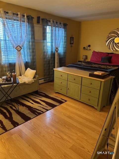 92 Angel Drive, Unit C Waterbury, CT 06708 - Photo 18 of 18 a bedroom with a bed and a dresser