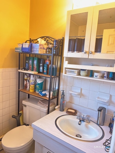 92 Angel Drive, Unit C Waterbury, CT 06708 - Photo 3 of 18 a bathroom with a sink and a toilet