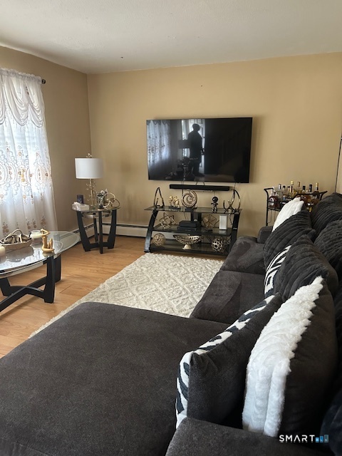 92 Angel Drive, Unit C Waterbury, CT 06708 - Photo 6 of 18 a living room with furniture and a flat screen tv