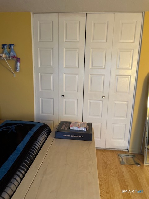 92 Angel Drive, Unit C Waterbury, CT 06708 - Photo 7 of 18 a view of a closet with wooden floor