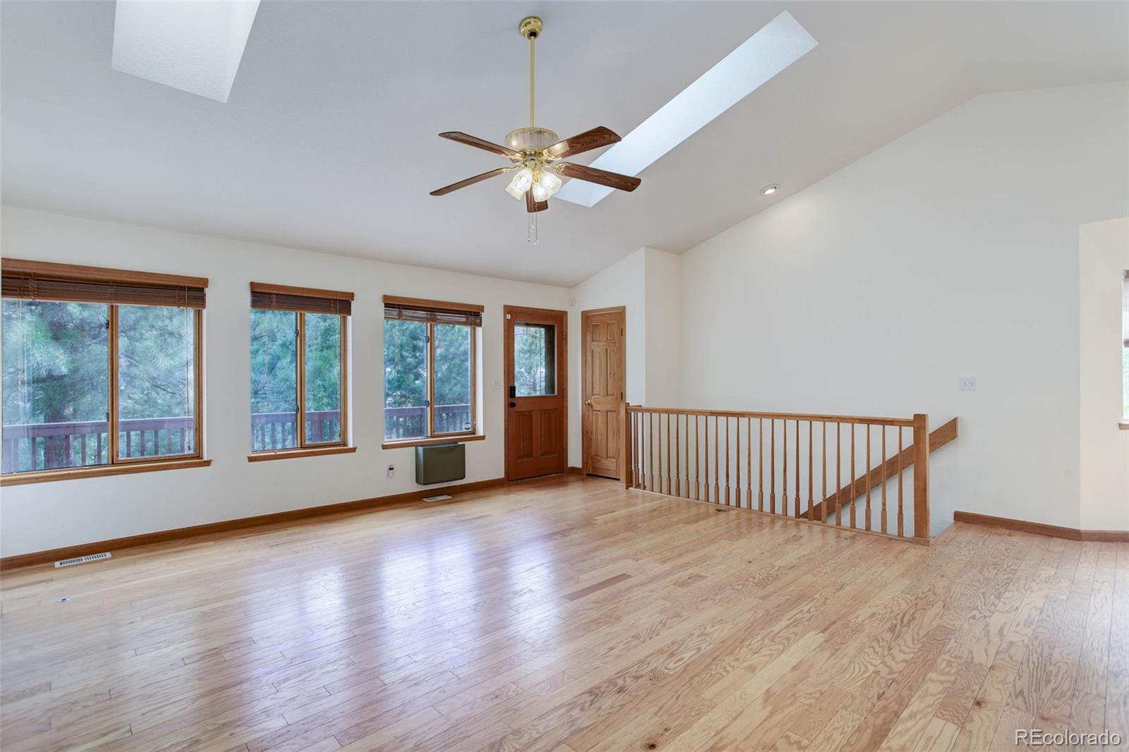 45 Catamount Ridge Road Bailey, CO 80421 - Photo 12 of 39 wooden floor in an empty room with a window
