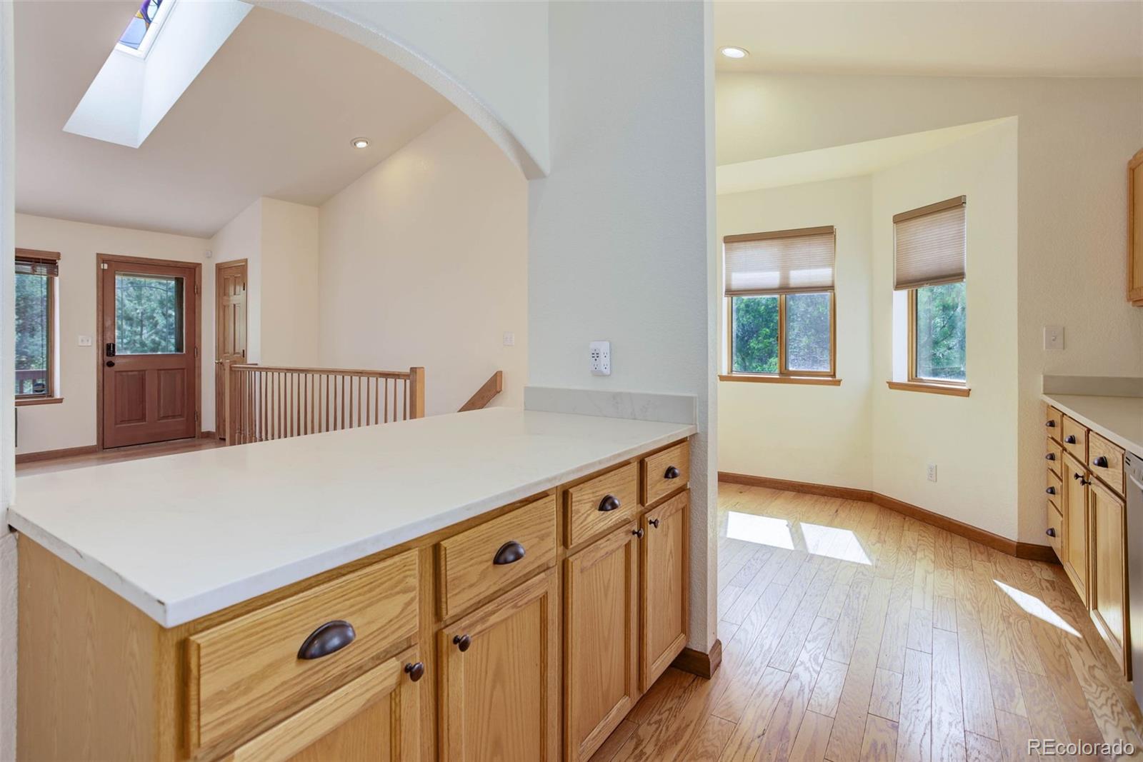 45 Catamount Ridge Road Bailey, CO 80421 - Photo 19 of 39 wooden floor in an empty room with a window