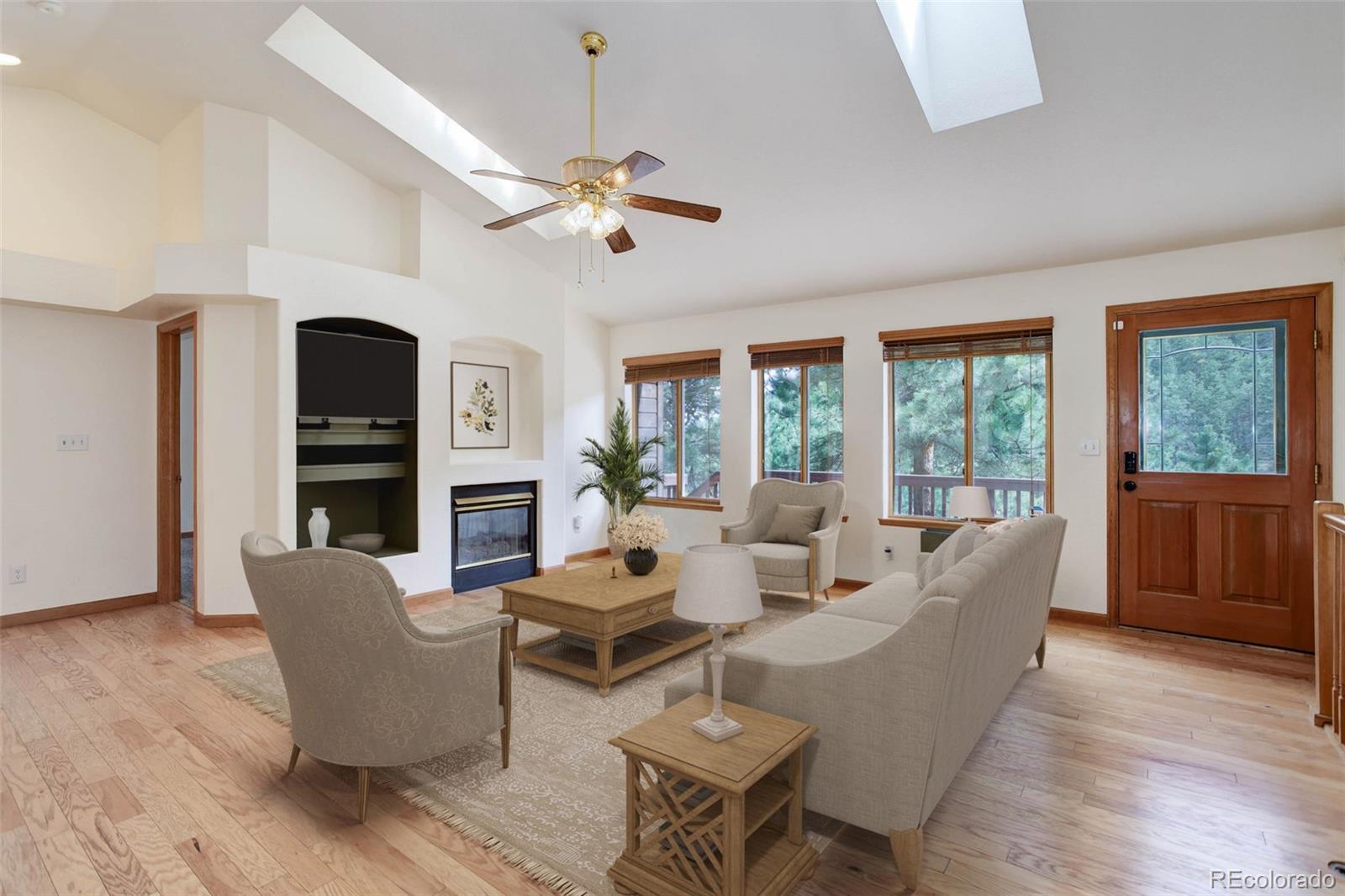 45 Catamount Ridge Road Bailey, CO 80421 - Photo 2 of 39 a living room with furniture a fireplace and a window