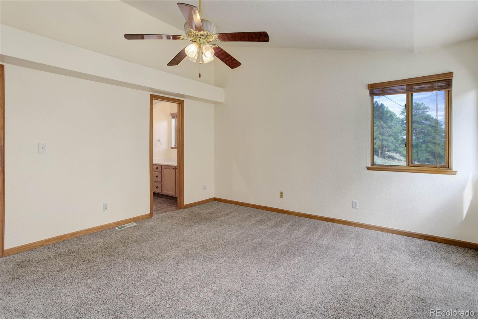45 Catamount Ridge Road Bailey, CO 80421 - Photo 22 of 39 an empty room with a window and a fan